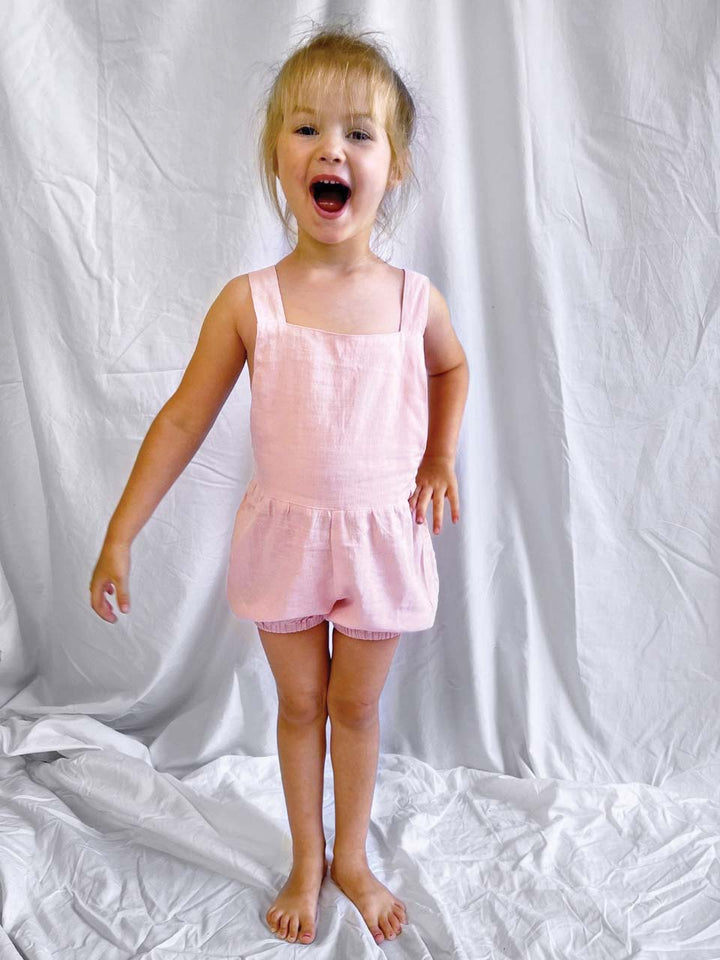 Kids overalls in light pink modelled front view