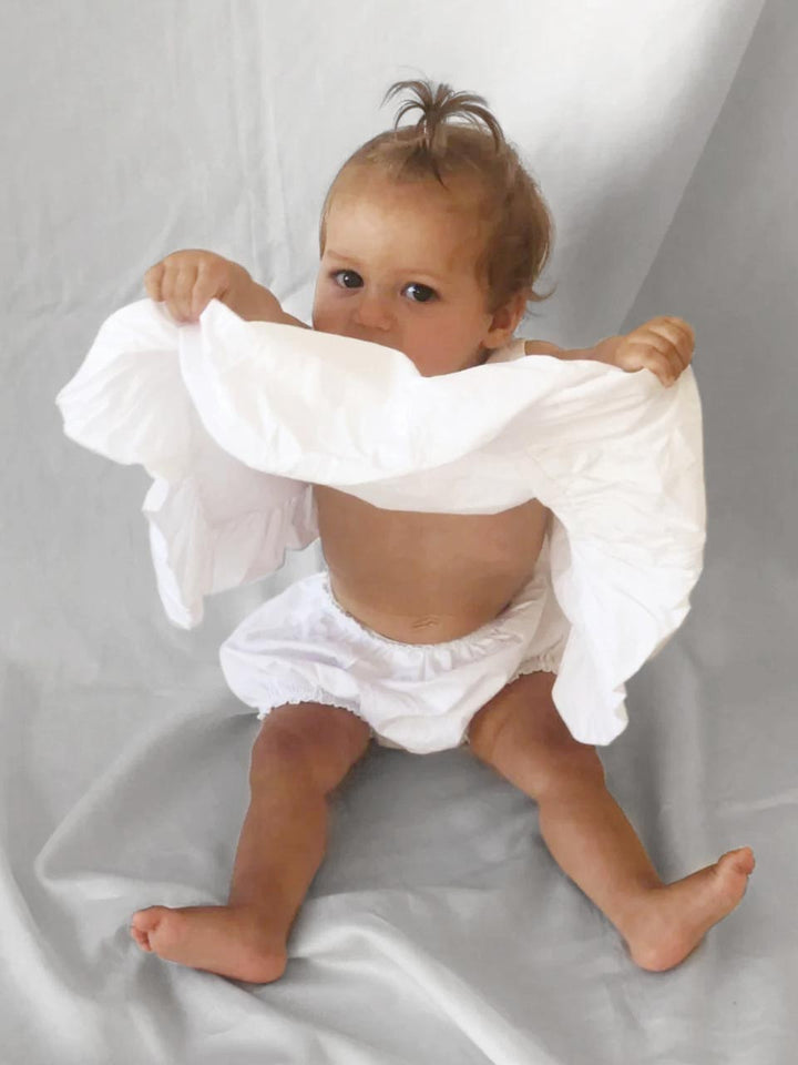 White dress and bloomers modelled