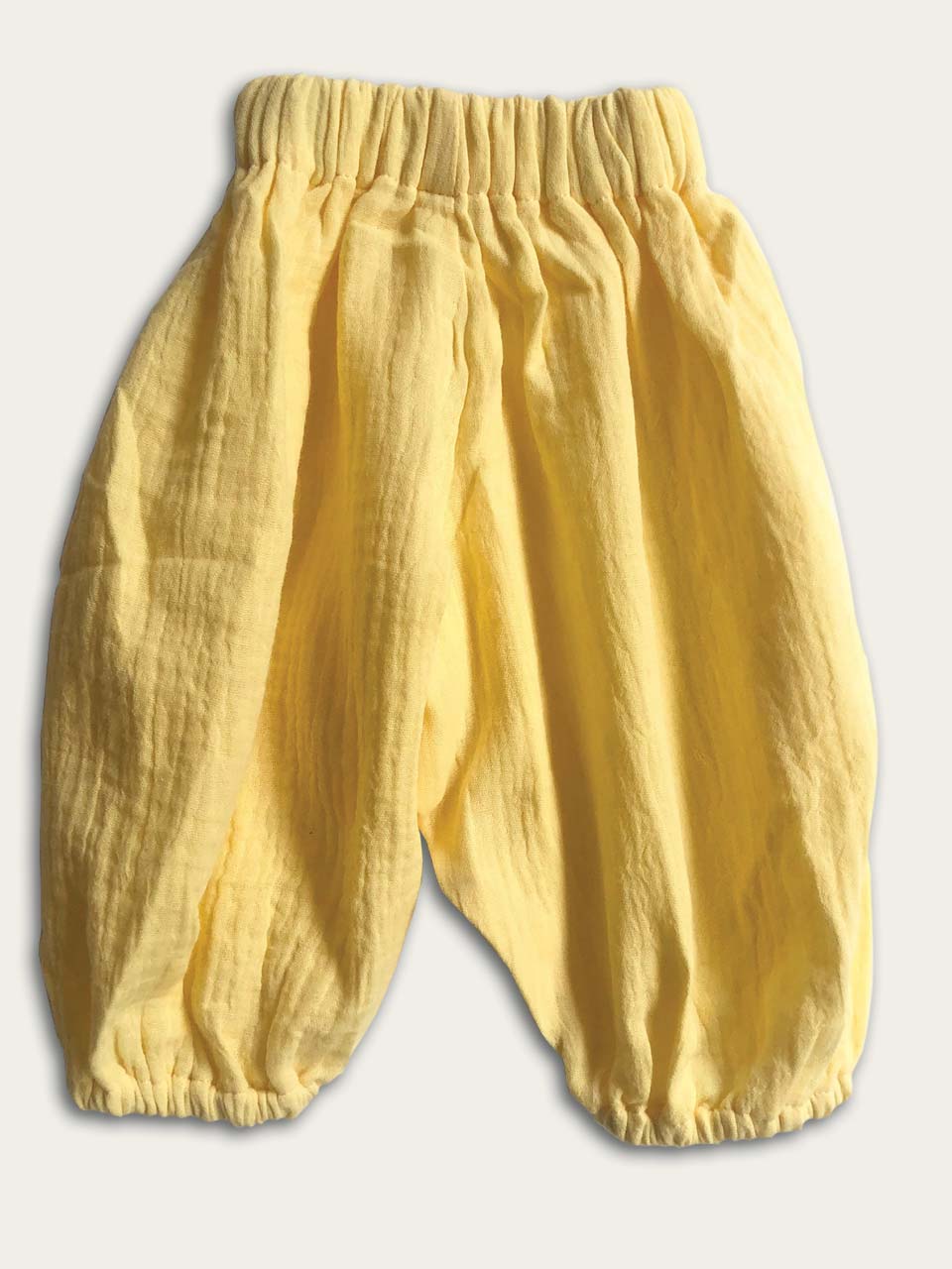 Happy pants in lemon front