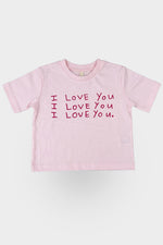 Pink t-shirt with 'I LOVE YOU' text on a grey background