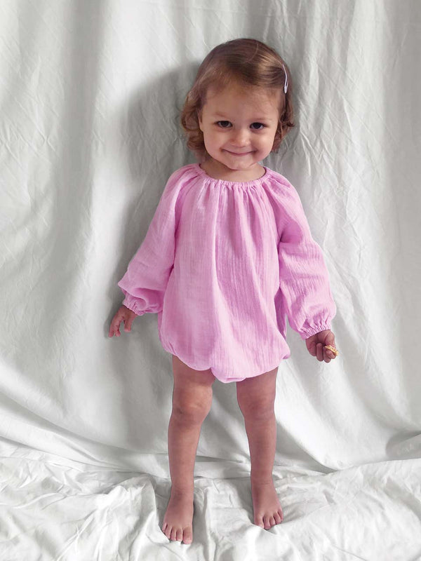 Romper with long sleeves in pink modelled front view