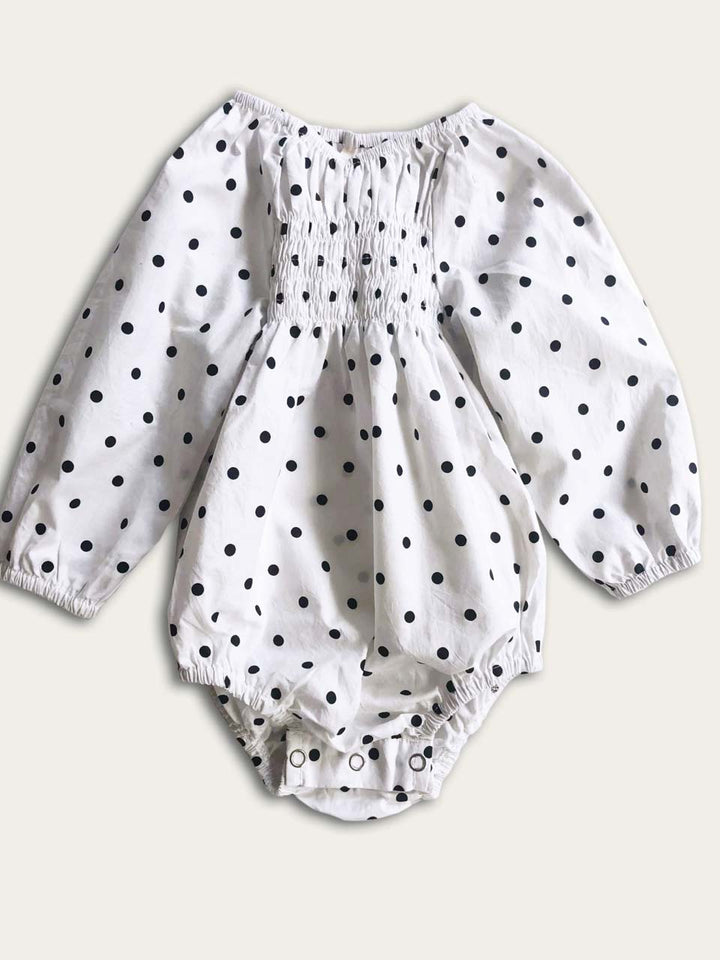 Romper smocked with long sleeves in polka dot front