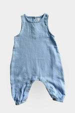 Blue baby jumpsuit on a light grey background