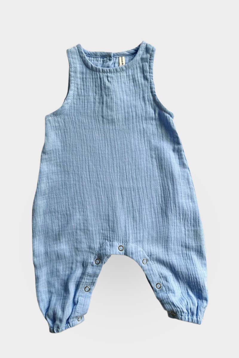 Blue baby jumpsuit on a light grey background
