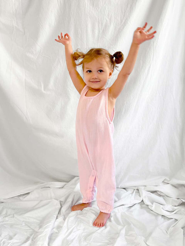 Baby jumpsuit sleeveless in light pink modelled front view