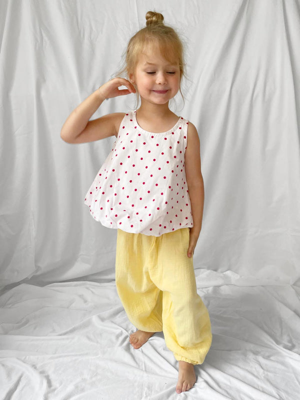 Red polka dot top with open back modelled