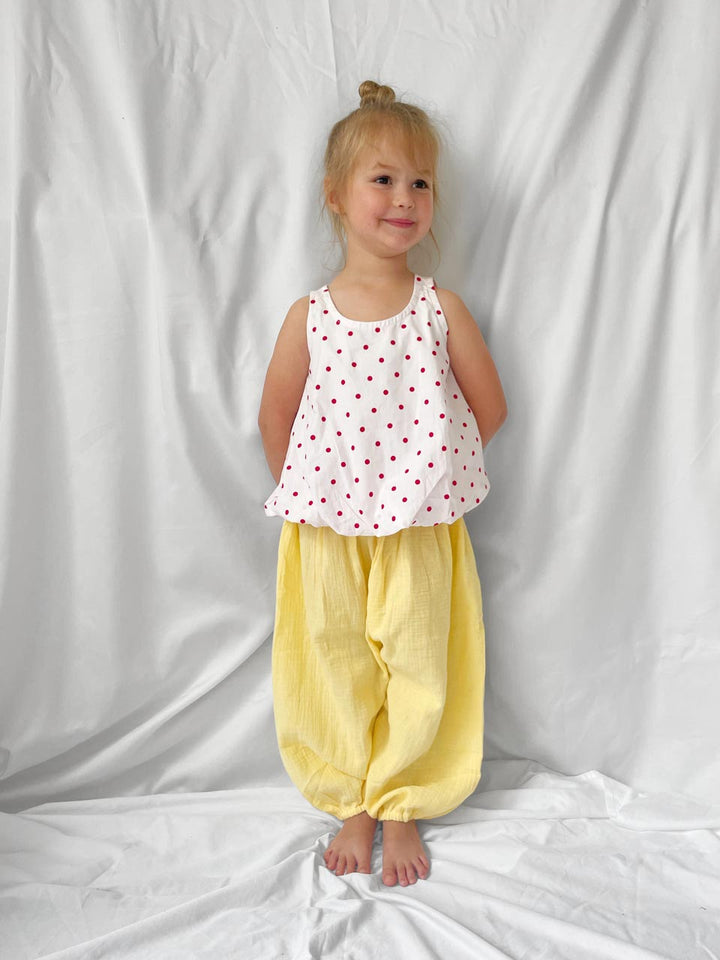 Red polka dot top with open back modelled