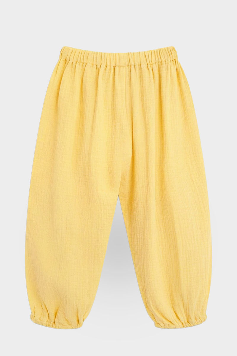 Yellow pants back on a light gray background