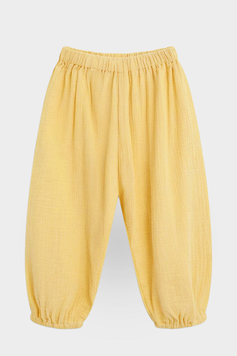 Yellow pants front on a light gray background