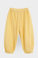 Yellow pants front on a light gray background