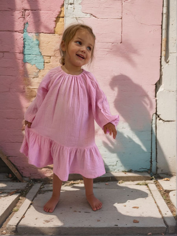 pink-twirl-dress-on-rainbow-background