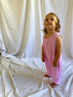 Baby jumpsuit sleeveless in pink modelled front view