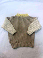 Image of our Anytime Knit in Desert colour on a white background with the arms crossed