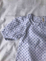 Close up shot of our Bubble Sleeve Blouse in Polka Dot