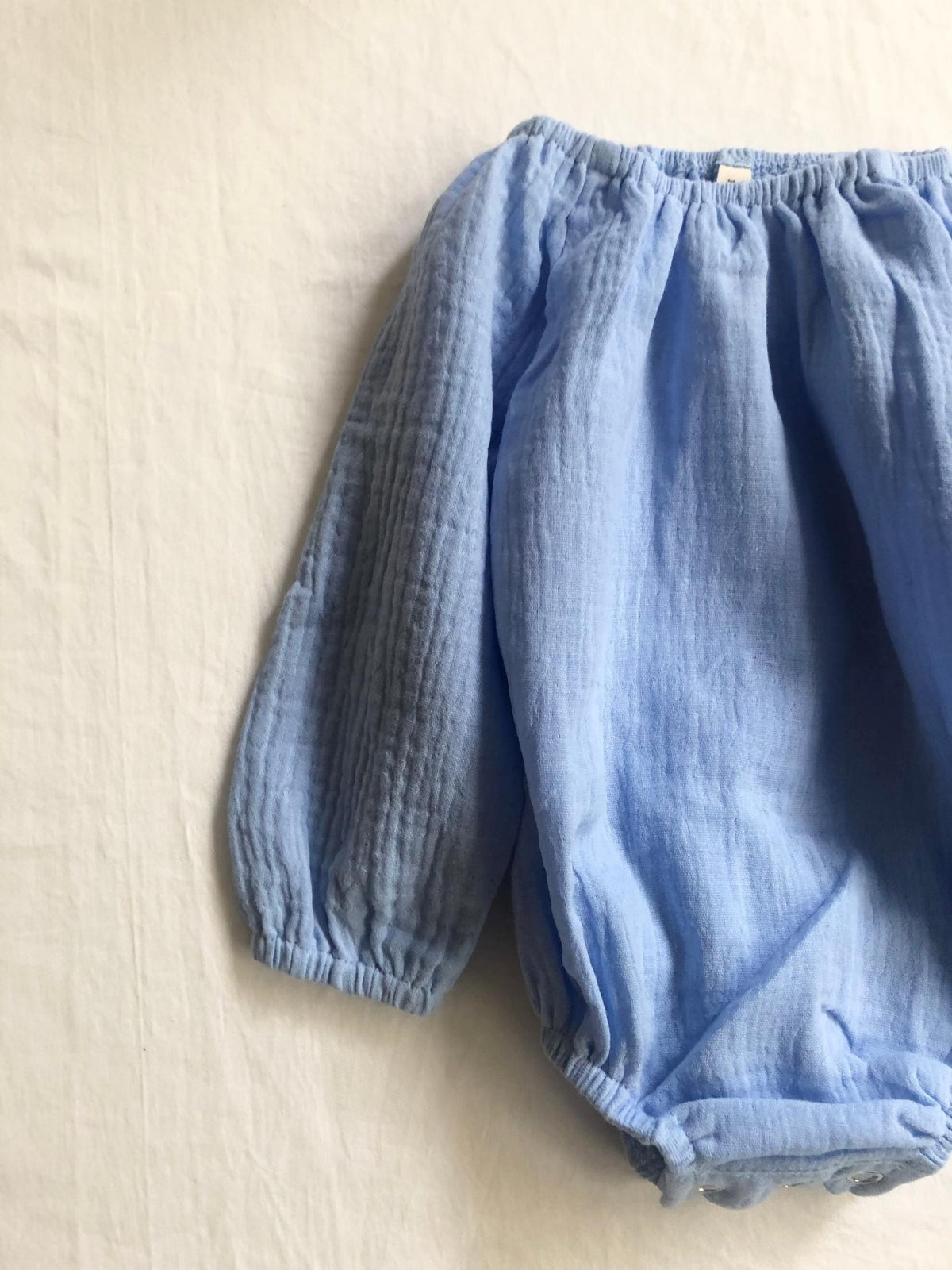 Romper with long sleeves blue modelled back view