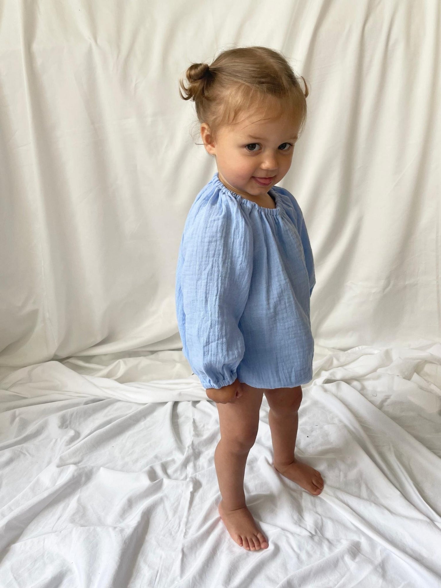 Romper with long sleeves blue modelled side view