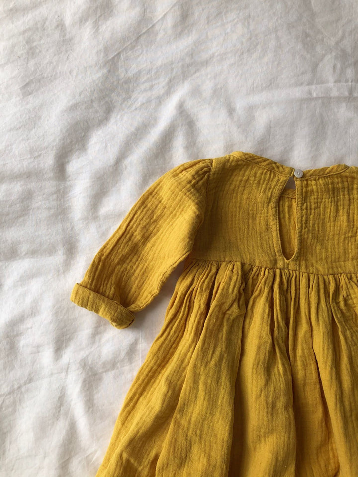 Yellow long sleeve dress back arm